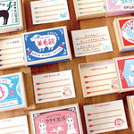 Blocs Matchbox Memo de Furukawa Shiko abiertos junto a sus hojas con líneas de cerillas